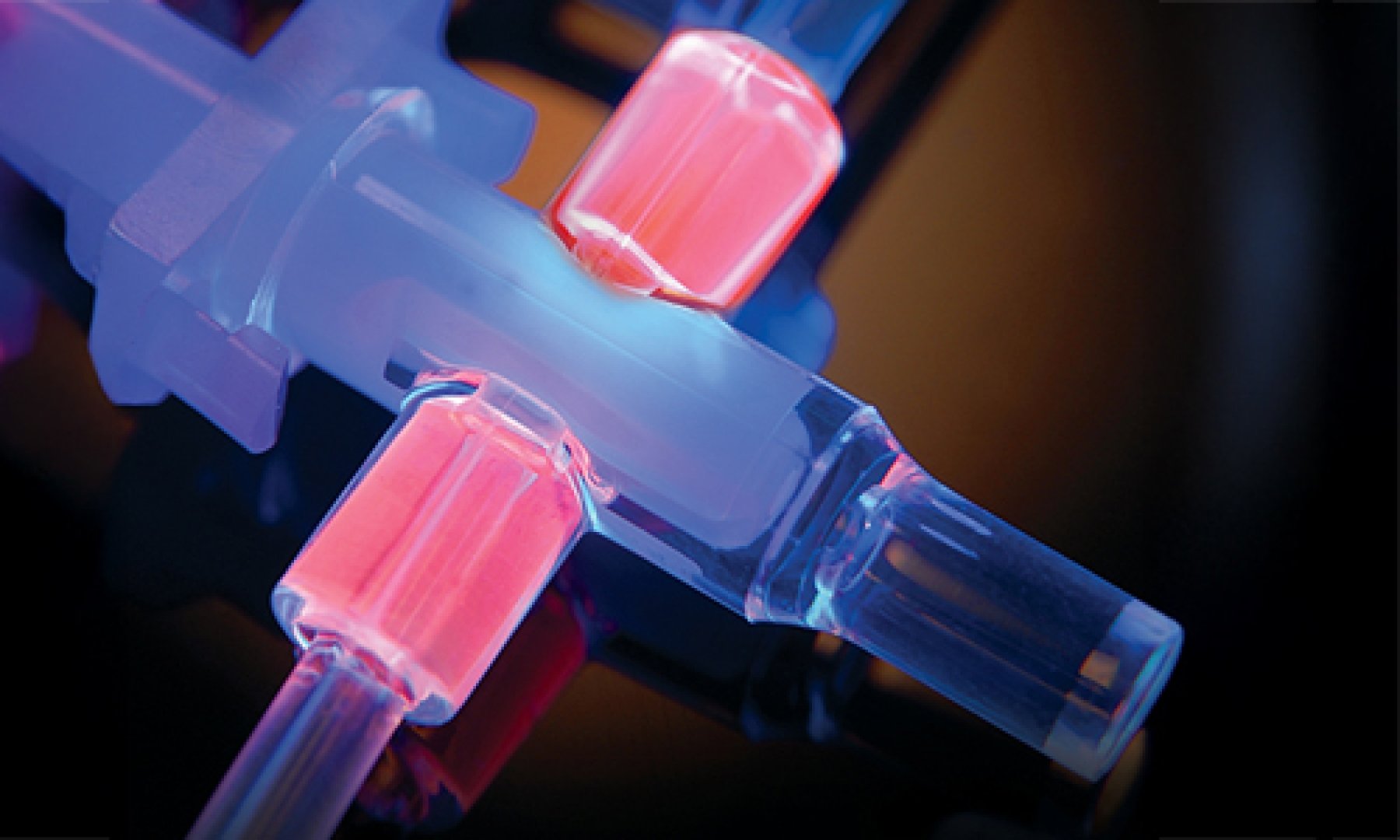 Dymax adhesives fluoresce bright red on plastic tube set substrates.